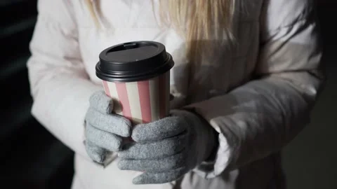 Close-up of a coffee Cup in a woman's hand. Stock-Footage 180127761