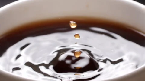 Close-up of coffee dripping in a cup Stock Footage 259603902