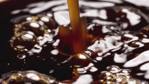Close-up of coffee dripping stirring Stock Footage 257985388