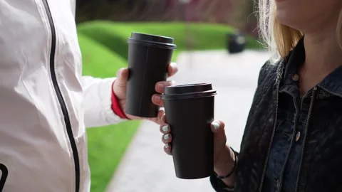 Close-up coffee glasses in hands. Stock Footage 263536981