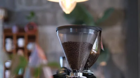 Close Up Coffee Grinder with Roasted Coffee Beans in Cozy Cafe Interior Stock-Footage 325236526