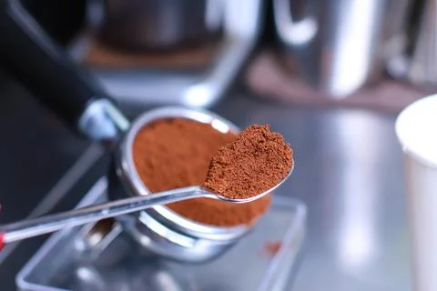 Close-up, coffee holder on the kitchen scale, ground coffee beans in the filter Stock Photos