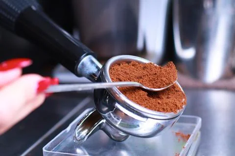 Close-up, coffee holder on the kitchen scale, ground coffee beans in the filter Stock Photos