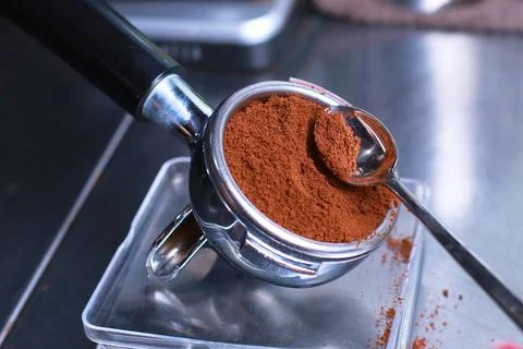 Close-up, coffee holder on the kitchen scale, ground coffee beans in the filter Stock Photos