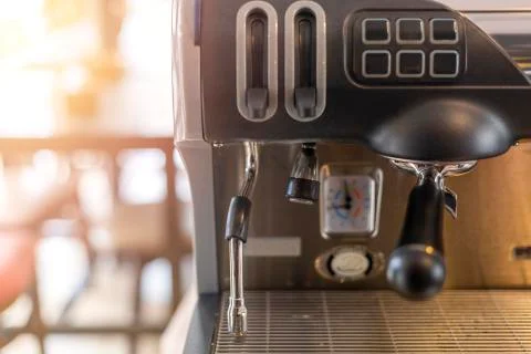 Close-Up of coffee machine in the coffee shop on morning time with sun light  Stock Photos