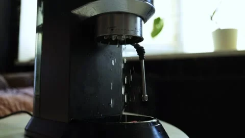Close-up of a coffee machine dispensing hot water for brewing coffee Stock Footage 338999632