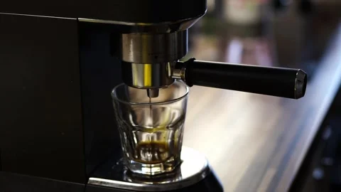 A close up of a coffee machine making a cup of coffee Stock Footage 267073354