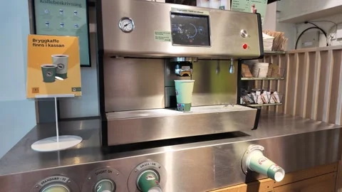 Close Coffee Machine Panel with Paper Cup and Metal Dispenser Stock-Footage 347683053