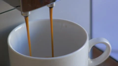 Close-up coffee machine pour espresso in white cup Stock Footage 47486649