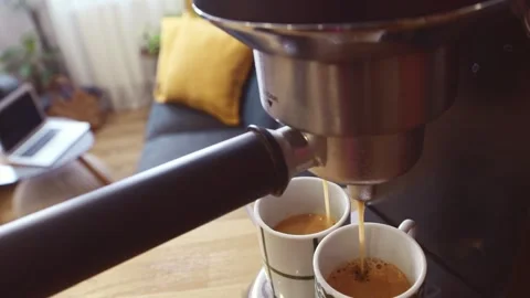 Close up coffee machine pour fresh made morning coffee in two beautiful dec.. Stock Footage 312492840