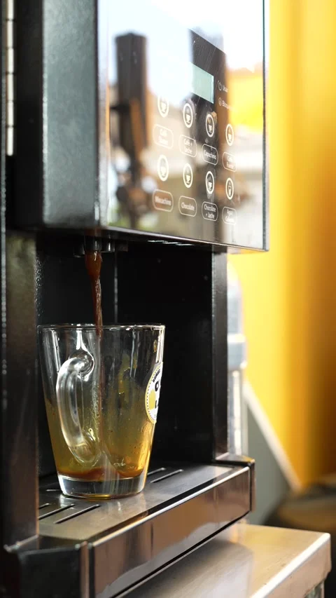 Close-Up of a Coffee Machine Pouring a Cappuccino Stock Footage 286168858