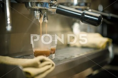 Close Up Of Coffee Machine Pouring Espresso In Cafe