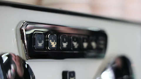 Close-up Of Coffee Machine Turning On. A Woman's Finger Presses The Button For Stock Footage 243165991