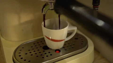 Close up of coffee machine with white cup of espresso Stock Footage 80129909