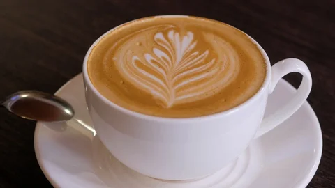 Close up of coffee made by a barista with a pattern on the surface. Stock Footage 106816873