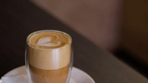 Close up of coffee made by a barista with a pattern on the surface. Video stock 106817244