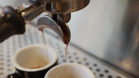 Close up coffee maker machine with black coffee cup. Coffee machine prepares. Co Stock Footage 159401787