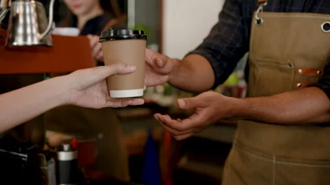 Close-up coffee mug, paper mug small size for drinking hot menu, with hand .. Stock Footage 247038339