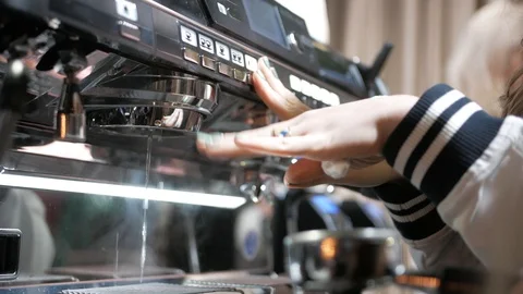 Close-up of coffee pouring from coffee machine. Professional coffee brewing 動画素材 103542382