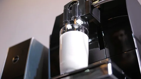 Close-up of coffee pouring from coffee machine. Professional coffee brewing Stock Footage 103542390