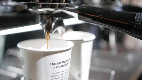 Close-up of coffee pouring from coffee machine. Professional coffee brewing 動画素材 103542411