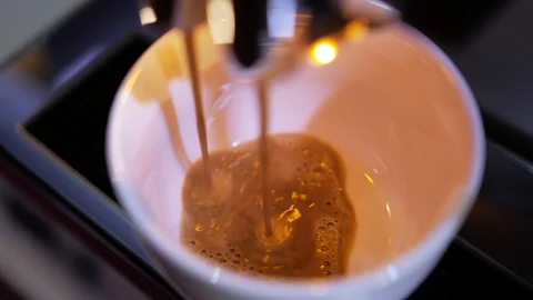 Close-up of coffee pouring from coffee machine. Professional coffee brewing 動画素材 103542418