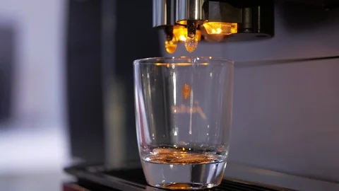 Close-up of coffee pouring from coffee machine. Professional coffee brewing 動画素材 103542424