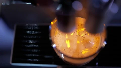 Close-up of coffee pouring from coffee machine. Professional coffee brewing Stock Footage 103542435