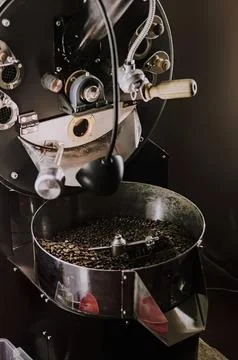 Close-up of a coffee roasting machine with beans inside Stock Photos