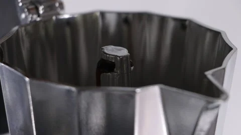 Close up of coffee start coming out of Italian coffee maker Stock Footage 263059036