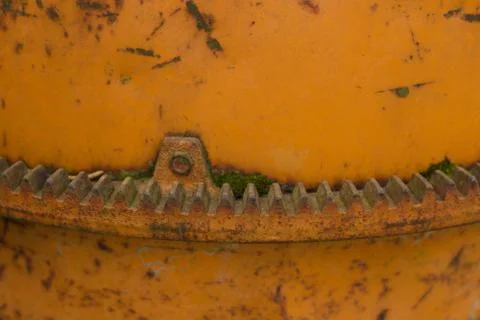 Close up of cogs or teeth on an old cement mixer Stock Photos