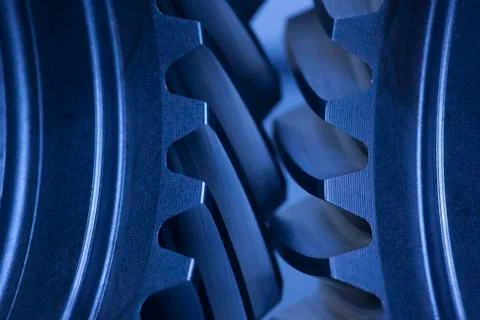 Close-up of cogwheels in an engine - dark blue colour - selective focus Stock Photos
