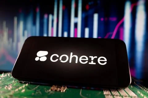 Close up of Cohere logo on smartphone screen with technology and financial chart Stock Photos