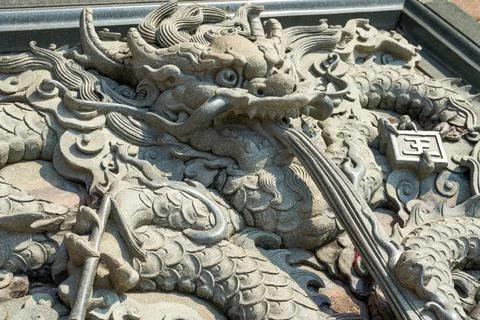 Close-up of coiled floating cloud dragon relief of traditional Chinese architect Stock Photos