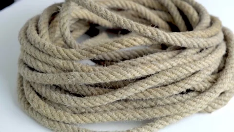 Close-Up of a Coiled Rough Twine Rope Used in Daily Activities. Rotate Stock Footage 310290475