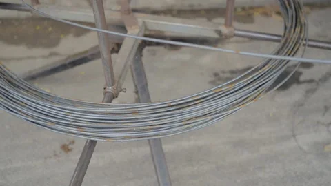Close up of coiled steel wire used in construction and manufacturing Stock Footage 341104121