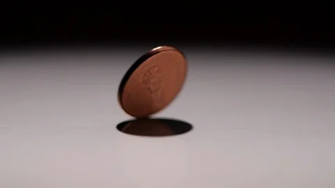 Close-up of Coin spinning in slow motion Stock Footage 126017987