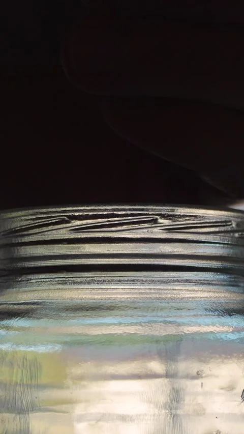 Close-up of coins being dropped into a glass jar 스톡 동영상 320190053