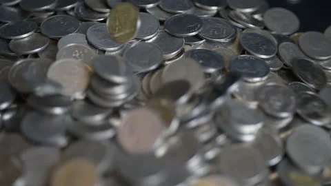 Close up coins with macro lens motion coins falling. Stock Footage 148916247