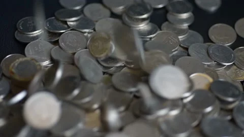 Close up coins with macro lens motion coins falling. Stock Footage 148916429
