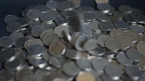 Close up coins with macro lens motion coins falling. Stock Footage 148916452