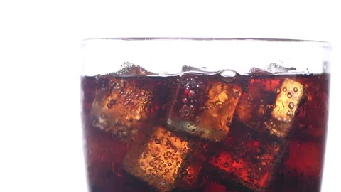 Close up of cola and ice cube in glass isolated on white background, Stock Footage 161109713
