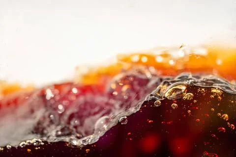 Close-up of cola soda with bubbles and ice cubes Stock Photos