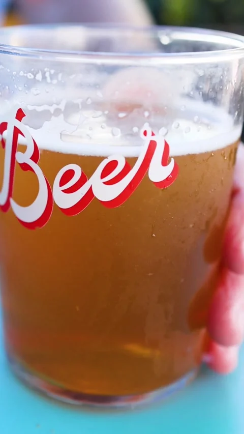 Close Up of a Cold Beer Glass with Red Script Text Vídeo Stock 329543984