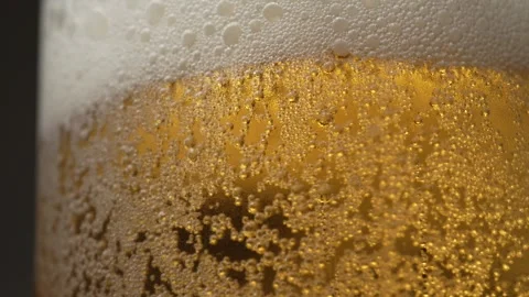 Close-up of cold beer pouring scene Stock Footage 314600535