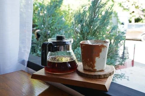 Close up cold drip coffee with ceramic clay cup Stock Photos