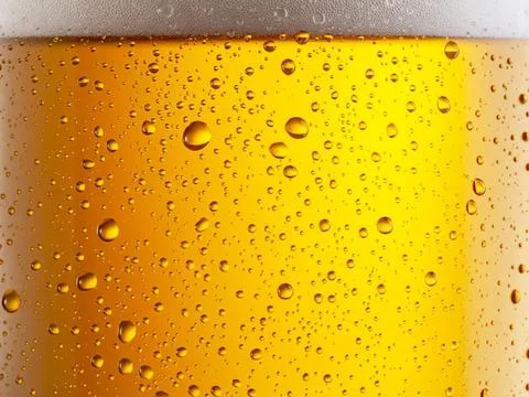 Close-up of a cold glass of beer with bubbles Stock Photos