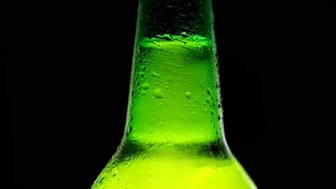 Close up cold neck of a beer bottle with water drops. Cold light beer Video stock 162031463