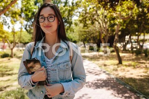 Close up of a college girl standing outdoors Stock Photos