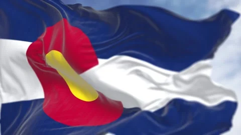 Close-up of Colorado state flag waving in the wind on a clear day Stock Footage 259954594